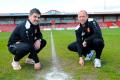 Tamworth FC assistant manager Mike Fowler (left) and manager Andy Morrell pictured on the soon to be dug up pitch in the Tamworth Herald