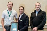 (L to R) Jim Price, Contracts Manager for MJ Abbott, receives the company’s ‘Top Flight’ award from the Rain Bird Corporation’s Director of Golf and International, J.R. Bergantino, and Jimmy Sandison, Regional Golf Sales Manager for the UK, Ireland, Iceland and Scandinavia