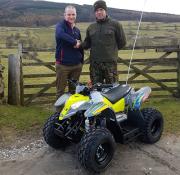Richard Coleby, Polaris’ district sales manager presenting the prize to Jamie Rhodes