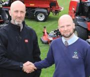 Course manager Jason Connaughton, left, shakes hands with Elliot Wellman from dealer Devon Garden Machinery