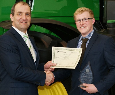 Allan Cochran presents the John Deere Ag Tech Apprentice of the Year award to Ewan Edwards of dealer RBM Agricultural Ltd