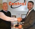 Newly appointed Sales Manager Steve Wroe (right) presents a compact digital camera and John Lewis gift card to Colin Gale on his last day