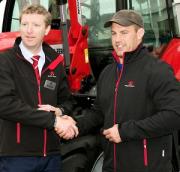 William Judge, Manager National Sales, Massey Ferguson UK & Ireland, hands over the keys to a MF 6700 Series to Sean O’Brien