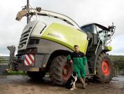 Winnie with owner Josh Sibley and the forage harvester she went under pictured in The Bridport & Lyme Regis News. Pic: BNPS