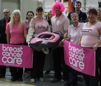 Husqvarna staff pictured with the Pink Automower on the fundraising day