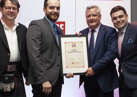Steve Morris, sales manager of Honda Power Equipment presenting the ATV / Quad Dealer of the Year Award to Huw Owen of Llyn ATVs And Garden Machinery, with Service Dealer owner Duncan Murray-Clarke (l) and comedian Charlie Baker (r) at 2018's ceremony
