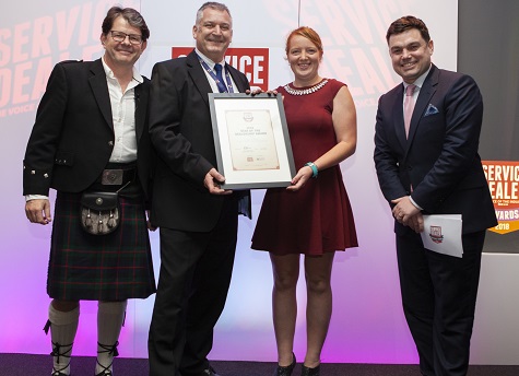 Winner of last year's Star of the Dealership award, Jess Parks of AF Wiltshire with Mike Cameron of award sponsor Catalyst Computer Systems, plus Service Dealer owner Duncan Murray-Clarke (l) and comedian Charlie Baker (r)