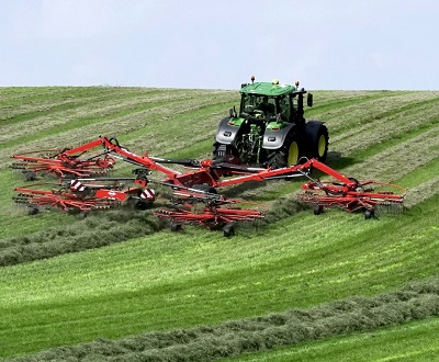 John Deere 6250R tractor equipped with a Kuhn Gyrorake