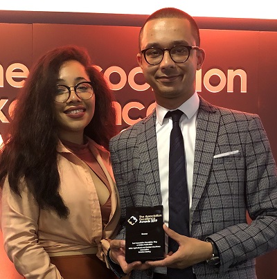 Paige Hylton and Alex Ahir, of the BAGMA & Bira marketing team, with the award