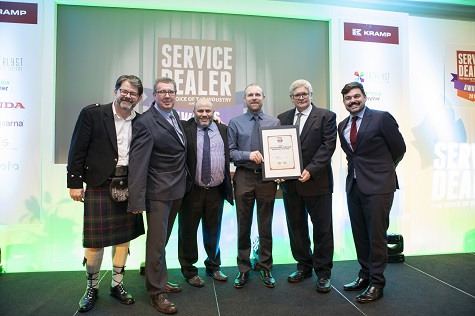 Les Malin, managing director of Etesia UK (second left) presenting the Professional Turfcare Dealer of the Year award at 2019's ceremony