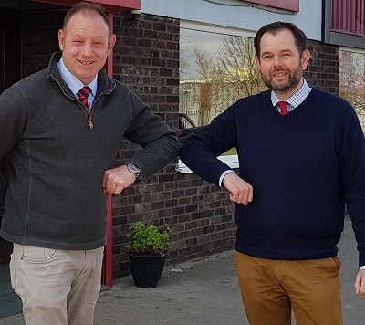 L-R: David Day, product manager for Maschio Gaspardo in UK ‘elbow bumping’ with Philip Stephenson, agricultural sales manager, Louth Tractors