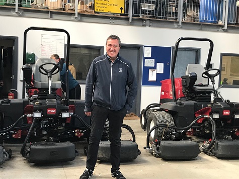 Dave Edmondson in front of some of his mowers