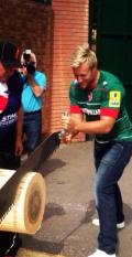 Leicester Tigers player Jordan Crane competing againt the Stihl Timbersports team at the sponsorship launch