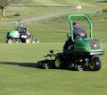 Two of the John Deere 2500E electric hybrid greens mowers at work on this traditional heathland course