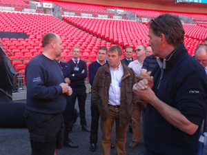 Wembley Stadium head groundsman Tony Stones chats to the visiting turf professionals