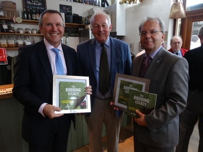 Chris Biddle makes presentation of his book to David Withers (left) and David Hagg