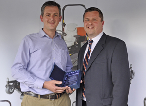 Tim Lane of TH White Ltd receives the Ransomes sales award from Sales Director Rupert Price