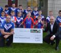 Briggs & Stratton's Ian Small presents the cheque to Bury Broncos rugby team