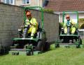 Two of The Landscape Group's new fleet of John Deere 1570 TerrainCut front rotary mowers working in Devizes