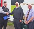 E-Z-GO's Andrew Bourke (left) presents the UK Dealer Award to David Common and Alistair McRobert