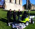 Grillo Area Manager Mike Garlick handing over the machine to representatives from the Abbey