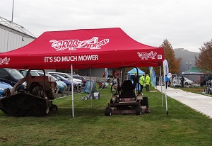 Grasshopper mowers on display outside