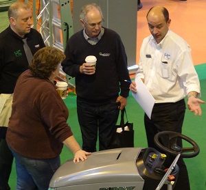 Visitors check out a new mower from Murray