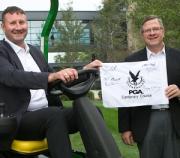 Gleneagles Director of Golf Gary Silcock (left) with John Deere worldwide Agriculture and Turf Division President James M Field