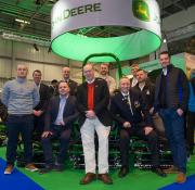 The 2018 TPC Sawgrass greenkeeping volunteers are pictured on the John Deere stand at BTME 2018, together with GCSAI general manager Damian McLaverty, BIGGA chief executive officer Jim Croxton and John Deere Limited divisional sales manager Chris Meacock