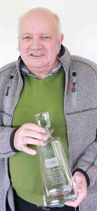 Bill Mitchell with his decanter presented to him by Reesink Turfcare in recognition of his career