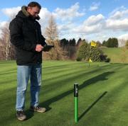 Jason Eldridge, head greenkeeper at Upchurch River Valley Golf Club, with the POGO moisture management system