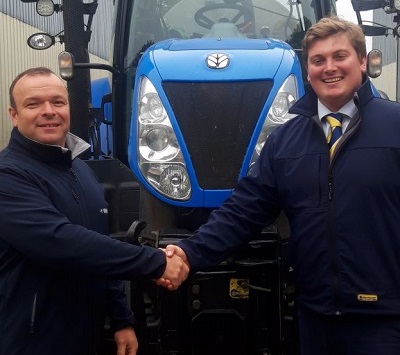 David Evans is welcomed to New Holland by George Mills, New Holland area sales manager 