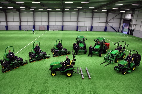 Burnley FC head groundsman Barry O’Brien (centre front) and his team with the new John Deere machinery fleet at the Barnfield Training Ground