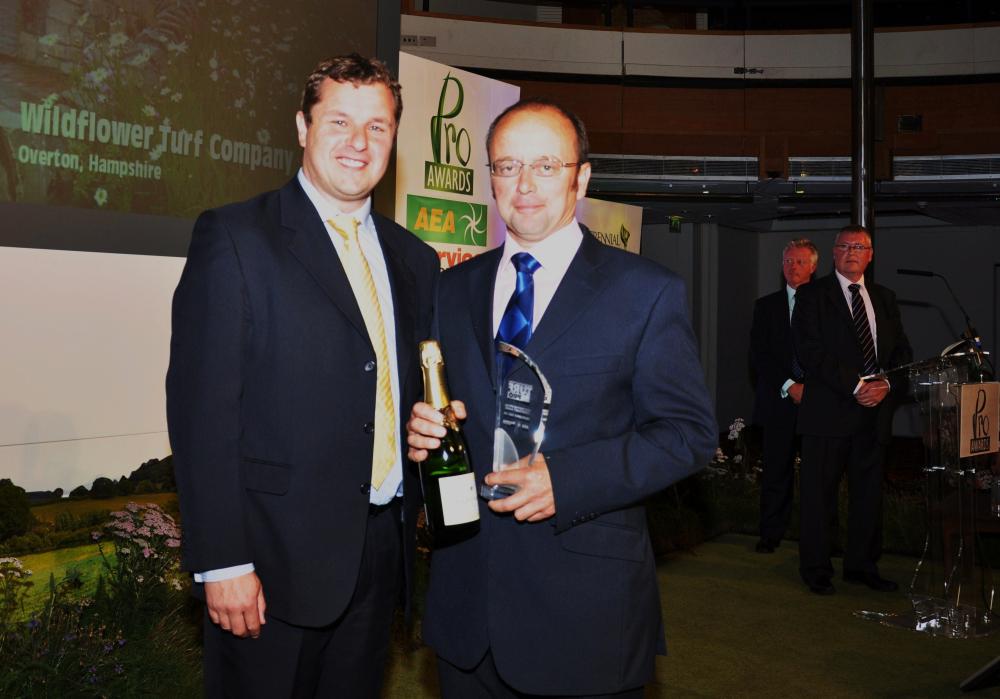 James Hewetson-Brown of the Wildflower Turf Company (right) collects the Turf Pro Special Achievement Award from Rupert Price of Ransomes Jacobsen