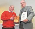 Ian Currie of Fuel Guard (left) being presented with the Ivel Award by IAgrE's Christopher Whetnell at LAMMA 2012