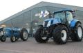 A tractor from 1964 parked next to one of New Holland’s latest innovations, a T7.235 AutoCommand.