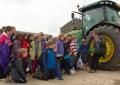 Yorkshire farmer Alistair Nelson talks about farm machinery to a group of Hull schoolchildren at Molescroft Farms in Beverley on last year’s Open Farm Sunday (photograph by Jerome Whittington/Photomoments).