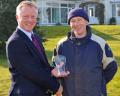 Richard Comely (left) presents Craig Cameron with a memento following his hole-in-one on the RJ National