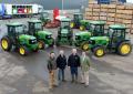 Burden Bros Agri dealer salesman Andy Page, Newmafruit managing director Tony Frankham and farm manager Tim Hall, and John Deere territory manager Paul Burnett, with seven of the new fleet of eight John Deere 5080GF fruit tractors at the Newmafruit headquarters in Kent.