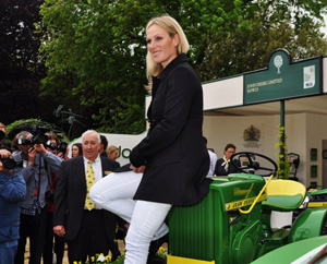 Zara Phillips (with Gordon Day behind) on an early John Deere lawn tractor