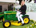 Zara Phillips on the restored John Deere lawn tractor at Chelsea