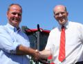 Tim Lawrence (right), AgriArgo UK area sales manager, welcomes Charlie Rollason to the McCormick tractor sales and service support network.