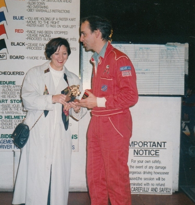 Peter receiving karting trophy from Trish Biddle at National Dealer Day in Nottingham