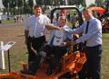 Simon Tullett [on machine], Dennis Opalacz from SCAG [left] and Geoff Webb, the Chief Executive of the IOG [right]