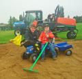 Head greenkeeper Alex McDermott pictured with his son Hadley at Rugby Golf Club
