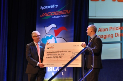 Alan Prickett of Ransomes Jacobsen present cheque to BIGGA's Jim Croxton
