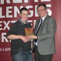 Daniel George receives Award from Alastair Taylor