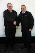 Sandy Leys, on the left, hands over the role of area sales manager for golf in North Scotland to David Raitt