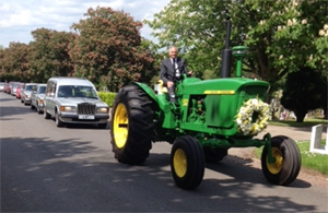 The 4020 leading the funeral cortege of 3 silver Rolls Royce cars owned by funeral directors AW Lymms of Nottingham