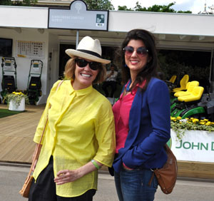 Singer Cerys Matthews (in hat) with a BBC colleague at the John Deere stand